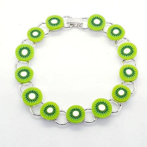 "Gorgeous KIWI FRUIT BRACELET Adorned with perfect miniatures of this delicious fruit! All secured to a high quality silver plated bracelet (7.5\" long) to fit the majority of adult wrists. Comes presented in a sweet little organza gift bag." Pig Ring, Fruit Bracelet, Forbidden Fruit, Kiwi Fruit, Silver Plated Bracelet, Pumpkin Earrings, Earring Stand, Delicious Fruit, Themed Jewelry