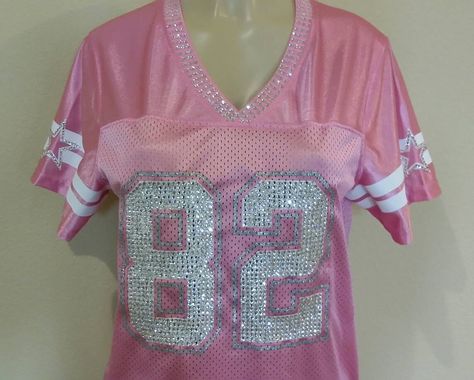 **Please read all details on custom blinged jerseys before purchase *My services include design, crystals, and labor only* - Women's Nike NFL jersey full bling: $249.99 ** Any jerseys with the #88, #86, #89 will be a $29.99 additional fee due to extra labor hours and crystal cost. **Customer must provide jersey, all jersey are shipped to my address** - Message me for my address - Jerseys feature over 2000-3000+ Swarovski Crystals - I spend 5-8 hrs hand setting every crystal to the jersey Process Bedazzled Jersey Rhinestones, Jersey Shore Style, Pink Out Outfit Ideas, Bedazzled Jersey, Bedazzled Outfit, Rhinestone Jersey, Diy Jersey, Bling Outfits, Football Cowboys