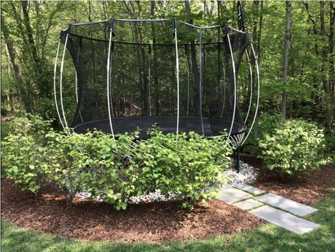 Trampoline In Backyard Ideas, Trampoline Landscaping Ideas, Above Ground Trampoline Landscaping, Trampoline Anchor Ideas, Landscape Around Trampoline, Landscaping Trampoline, Backyard Trampoline Landscape, Under Trampoline Landscaping, Trampoline In Garden