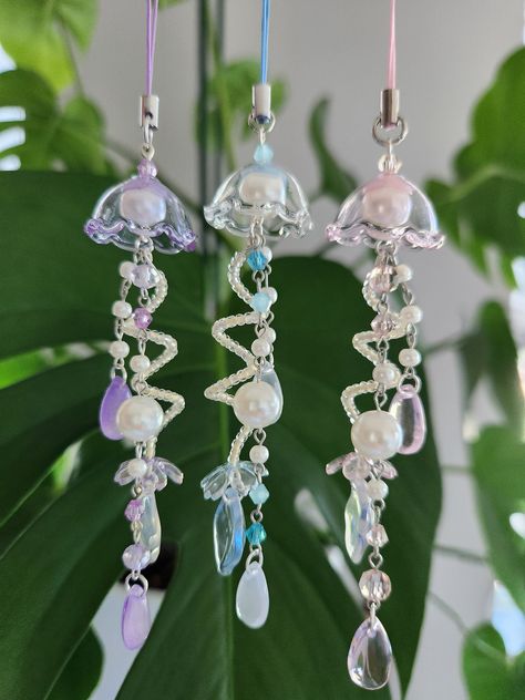 beautiful handmade pearl jellyfish phone charm in a cute coquette style also available as a keychain Pearl Phone Charm, Kawaii Coquette, Keychain Pink, Diy Jewelry Earrings, Mermaid Aesthetic, Beaded Jewlery, Craft Night, Cute Keychain, Beaded Bracelets Diy