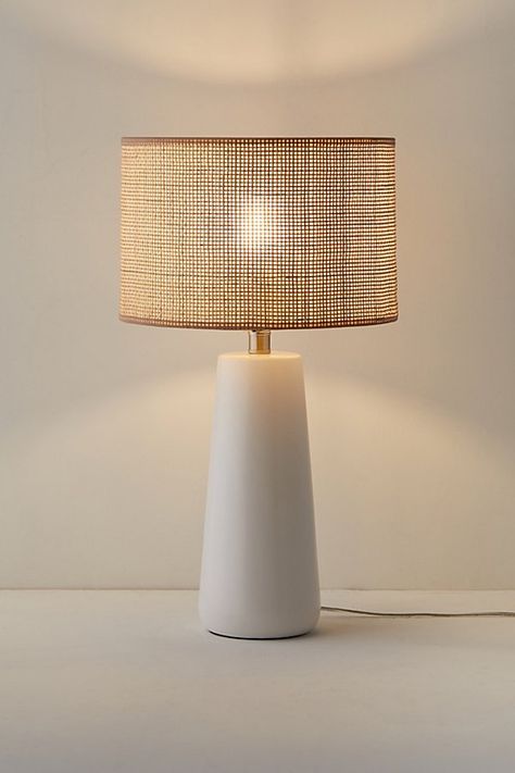 Create a serene, coastal scene in your space with this table lamp. Features a round ceramic base with a natural rattan drum shade that offers a warm feel to your lighting essentials. Equipped with a 3-way rotary switch that allows you to easily adjust the brightness to fit your needs. Plugs in to power on. Features Boho coastal table lamp Ceramic base Natural woven rattan drum shade Plug in 3-Way rotary switch Compact fluorescent compatible Requires one E26 Type A 100W 3-way bulb - not included Content + Care 50% Rattan, 40% ceramic, 10% electric Wipe clean Imported Made in compliance with US electrical standards. To use this item outside of the US, pair with an outlet adapter and voltage converter made specifically for use in your location. Size Wattage/Voltage: 100W/120V Dimensions: 12.5 Zara Home Lamps, Lamps Bedroom Nightstand, Boho Table Lamp, Beach Lamps, Coastal Lamp, Coastal Table, Cute Living Room, Boho Lamp, Apartment Decorating Living