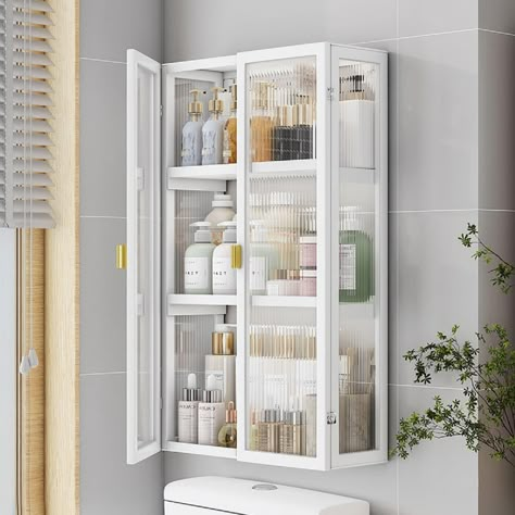 PRICES MAY VARY. 💖Wall Storage Cabinet - Having this storage cabinet mounted on the wall can maximize the use of space and save valuable floor space. You can install it at a suitable height for quick access to your items. 💖Storage Cabinet - This wall cabinet is designed with three tier shelves, which provides you with a flexible storage solution to classify and store different items. More items could also be displayed on the top of it. 💖Sturdy Material - Made of heavy-duty steel, clear acryli Small Cabinet Storage Ideas, Ikea Bathroom Hacks Storage, Large Bathroom Closet Organization, Wall Cabinet For Bathroom, Bathroom Built In Storage Cabinet, Bathroom Wall Cabinets Storage, Bathroom Storage For Small Bathroom, Space Between Toilet And Vanity, Bathroom Wall Mounted Cabinet