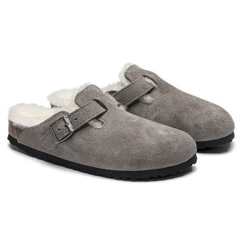 The perfect shoe for cozy fall and winter evenings, these Birkenstock Boston Shearling Suede Clog Shoes for Women in Stone Coin Grey are ones you will never get tired of. Arch support, custom fit, wool footbed lining, and clog design are some of the features that make up this fashion staple footwear. Get yours for the upcoming holidays! Features of Birkenstock Boston Shearling Suede Clog Shoes for Women in Stone Coin Grey 1017651: Birkenstock Style: 1017651 Color: Stone Coin Grey Signature clog Boston Shearling, Birkenstock Boston Shearling, Cow Hide Shoes, Boston Clogs, Birkenstock Men, Clean Life, Birkenstock Women, Suede Clogs, Birkenstock Boston