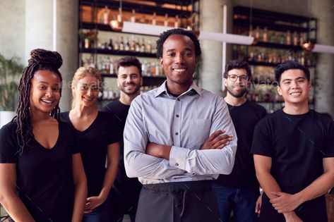 Portrait Of Male Owner Of Restaurant Bar With Team Of Waiting Staff Standing By Counter by monkeybusiness. Portrait Of Male Owner Of Restaurant Bar With Team Of Waiting Staff Standing By Counter #Sponsored #Restaurant, #Bar, #Owner, #Portrait Restaurant Staff Photoshoot Ideas, Restaurant Team Photography, Restaurant Headshots, Restaurant Owner Photography, Restaurant Staff Photography, Environmental Headshots, Restaurant Photoshoot, Start A Restaurant, Waiting Staff