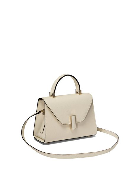 Find VALEXTRA Iside Micro' Crossbody Bag on Editorialist. Valextra's 'Iside Micro' shoulder bag is made of Millepunte calfskin with contrasting inlays and features a gold-tone metal clasp with leather insert. The removable and adjustable shoulder strap allows it to be worn comfortably over the shoulder or on the shoulder. Each bag has a unique serial number that identifies the date of production and the artisan responsible for its creation. Hand-painted Ink lines and black lacquered edges are distinctive details of Valextra bags. - Dimensions: 19.5x14x9.5 cm - Gold-colored metal clasp with leather insert - Removable and adjustable shoulder strap - Unique serial number for each bag - Hand-painted Ink lines - Black lacquered edges - Versatile style suitable for any occasion For the elegant w Valextra Bag, Valextra Iside, Micro Bags, Italian Elegance, Hand Bags For Women, Leather Satchel Bag, Style Noir, Crossbody Tote, Womens Crossbody Bag