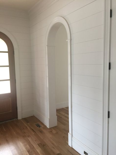 Shiplap walls with arched opening in foyer Moulding For Arched Doorways, Shiplap Arched Wall, Interior Arched Openings, Shiplap Around Arched Doorway, Trim On Arched Opening, Accent Wall With Arched Doorway, Arched Opening Kitchen, Shiplap Archway, Arched Hallway Entryway