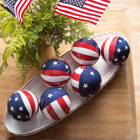 PRICES MAY VARY. Foam Add a patriotic look to home decor or other decorative pieces with these stars and stripes orbs. A great addition to Fourth of July decorations, these orbs look great in buckets, pails or any other container that needs a boost of patriotism. Display these orbs on the Fourth of July or any other patriotic holiday – or anytime of year when you want to show off your pride in the USA! Foam. (6 pcs. per unit) 3 1/2" diam. Foam. (6 pcs. per unit) 3-1/2" diam. Patriotic Decorations Diy, 4th Of July Tiered Tray Decor, Decorative Orbs, Patriotic Tiered Tray Decor, Bucket Decor, Patriotic Decorations Party, Military Christmas, Indoor Holiday Decor, July Desserts