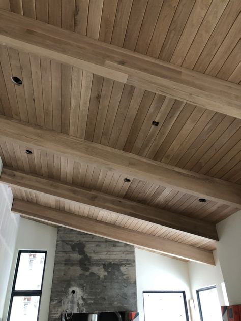 White Oak Tongue and Groove with White Oak beam wraps. Outdoor Vaulted Wood Ceiling, Tongue And Groove With Beams, Interior Beam Stain Colors, Oak Tongue And Groove Ceiling, Tongue And Groove Deck Ceiling, Tongue And Groove Ceiling Dining Room, Tongue And Groove Living Room Ceiling, White Oak Paneled Walls, Vaulted Ceiling Tongue And Groove