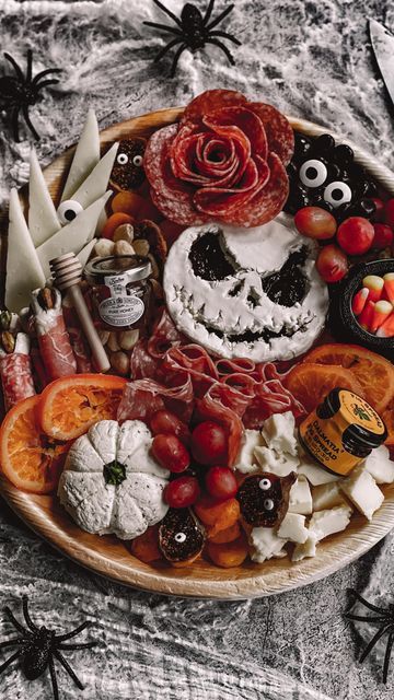 Halloween Food Ideas Charcuterie, Jack Skellington Snacks, Halloween Prosciutto Skull, Ghost Face Brie, Ghostface Brie, Scream Face Brie, Halloween Pumpkin Charcuterie Board, Witch Charcuterie Board Ideas, Pumpkin Shape Charcuterie Board