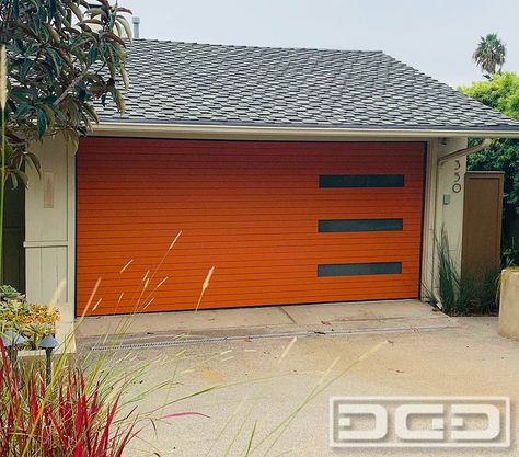 This garage door design is the answer to the high demand in recent years for an appropriate substitue for broken down garage doors on real Mid century style homes. The Mid Century 07 garage door is a fabulous, minimalist door that captures the essence of the period with such precision that it has been used in authentic Mid Century Modern home renovations in places like Palms Springs, CA and Long Beach, cA. The double-car garage door is composed of horizontal boards from top to bottom. Wooden Garage Door, Cedar Garage Door, Modern Wood Doors, Custom Wood Garage Doors, Roll Up Garage Door, Contemporary Garage, Cedar Door, Wooden Garage Doors, Custom Garage Doors