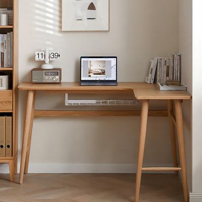 Maximize your workspace with our all-wood corner desk. Efficiently utilizing your home's 90° corners, it offers expanded desktop space. Featuring an L-shaped design with a built-in cable hole and under-desk metal cable organizer, it keeps your workspace tidy. Sturdy, with wide-set legs and reinforcing crossbars, it's both stable and durable. Rounded edges ensure safety and comfort. Elevate your work experience with this sleek and functional desk. | Orren Ellis 62.99"L-shaped wood solid wood desk Study Desk Ideas Simple, Mcm Office Desk, Boys Room Corner Desk, Desk In Corner Of Bedroom, Small Room Corner Desk, Boho Corner Desk, Corner Work Desk, Corner Desk Small Space, Entryway Desk Ideas