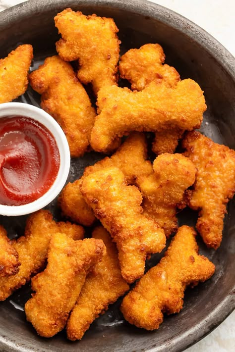 Whenever I need something quick and easy that my kids are guaranteed to eat, I go straight to frozen dino nuggets cooked in the air fryer. Just as crispy as if they'd been deep fried, but way faster, way lighter, and without all the mess. Dino Nuggets Air Fryer, Nugget Aesthetic, Chicken Nuggets Aesthetic, Dinosaur Nuggets, Dino Nuggies, Dinosaur Chicken Nuggets, Dino Nuggets, Quick Appetizers, Quick Easy Snacks