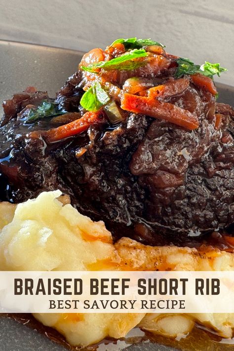 Learn how to make the juiciest braised beef short ribs recipe in your own dutch oven. This recipe has two options - one is instructions for a tender red wine braised beef short ribs, guarantee to fall off the bone, the second option is a savory braised beef short rib cooked in savory beef broth, with no wine. Both options are juicy, full of flavor and perfect for those on Paleo Short Ribs Dutch Oven, Short Ribs In Oven, Short Rib Recipes Oven, Braised Beef Short Ribs Recipe, Ribs Recipe Oven, Braised Beef Recipes, Dutch Oven Beef, Braised Short Ribs Recipe, Braised Beef Short Ribs