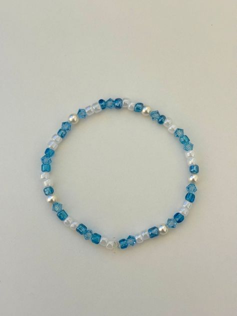 A handmade blue bracelet with freshwater pearls. This bracelet goes with any outfit and is perfect to stack with other bracelets. One size fits all Blue And White Beaded Bracelet, Blue Bracelet Stack, Blue Bracelet Ideas, Prom Prep, Light Blue Bracelet, Blue Bead Bracelet, Bead Bracelet Stack, Dolphin Bracelet, Purple Beaded Bracelets