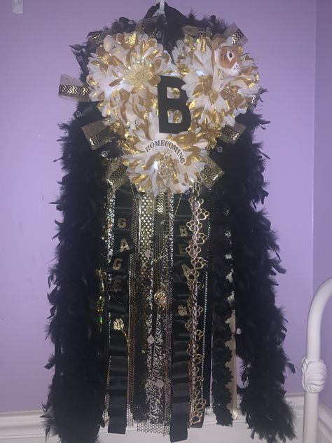 Homemade big Texas sized junior mum black and gold colors Big Mum, Texas Mums, Mum Ideas, Homecoming Spirit, Senior Overalls, Homecoming Mums Diy, Homecoming Mums, Gold Colors, Garters