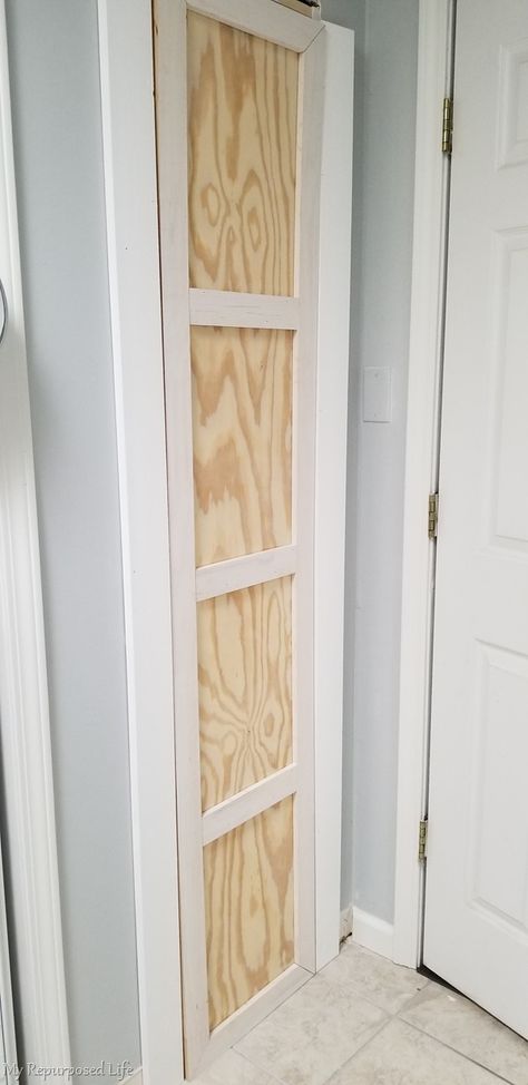 Building a closet between the studs is a great option for the kitchen or bathroom.This diy storage closet is perfect for storing tall items. #MyRepurposedLife #diy #closet #organization Between Studs Broom Closet, Tiny Broom Closet, Closet Between Studs, Butlers Laundry, Spice Closet, Storage Between Studs, Broom Closet Organization, Budget Renovations, Broom Closet Organizer