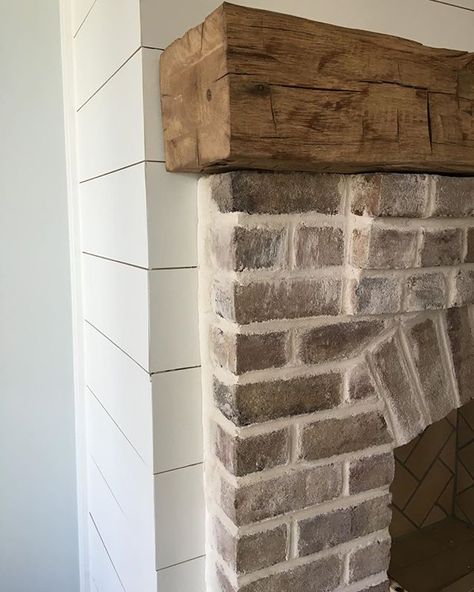 whitewashed brick; rustic wood mantel; shiplap Fireplace Redo, Trendy Farmhouse, White Wash Brick, Shiplap Fireplace, Farmhouse Fireplace, Wood Mantels, Fireplace Remodel, Fireplace Ideas, Home Fireplace