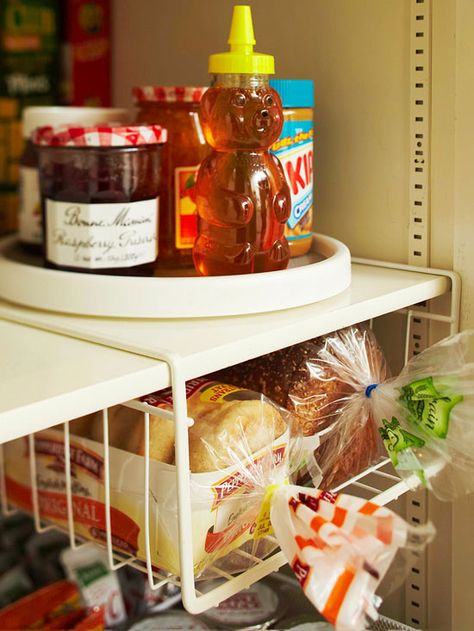 A lazy Susan makes it easy to find condiments that otherwise get pushed to the back of the pantry. More simple storage solutions: http://www.bhg.com/decorating/storage/organization-basics/simple-storage-for-less/?socsrc=bhgpin060213lazysusan=3 Organize Pantry, Diy Pantry Organization, Cocina Diy, Easy Hacks, Diy Pantry, Bread Storage, Kitchen Organization Pantry, Ideas Para Organizar, Diy Kitchen Storage