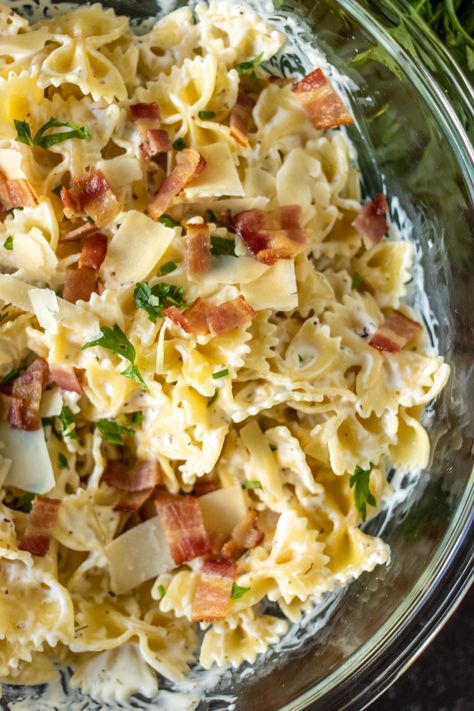 Creamy Bow Tie Pasta with bacon is simple comfort food that is easy to customize with grilled chicken, veggies, or delicious as is. With only seven ingredients and 30 minutes, you can have a family favorite on the table. | www.persnicketyplates.com Bacon Bow Tie Pasta, Chicken Pasta Recipes Bowtie, Chicken With Bow Tie Pasta, Bow Tie Pasta And Chicken Recipes, Bow Ties Pasta Recipes, Chicken Broccoli Bowtie Pasta, Chicken Bacon Bowtie Pasta, Bacon Bowtie Pasta, Pasta Bow Tie Recipes