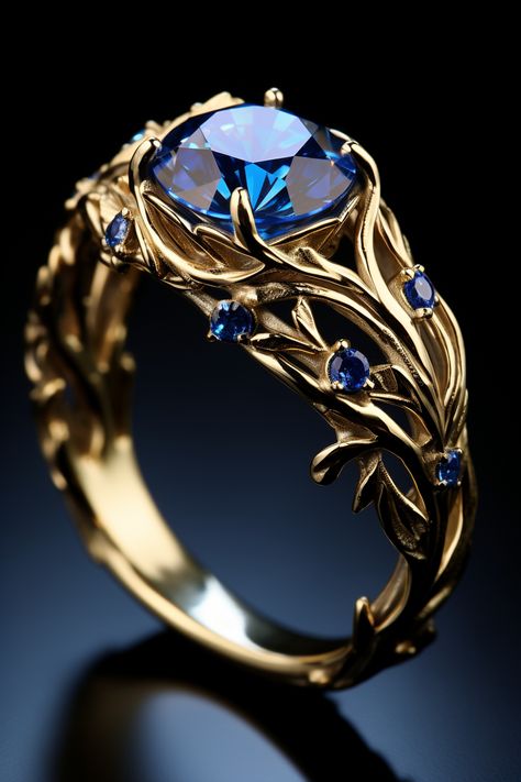 a gold ring with one big blue stone and a few smaller blue stones Fantasy Wedding Rings, Fantasy Jewelry Magic, Diy Wire Jewelry Rings, Pretty Engagement Rings, Fantasy Ring, Wire Jewelry Rings, Diamond Fashion Jewelry, Cute Engagement Rings, Blue Ring