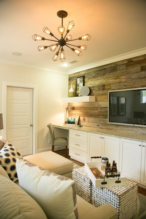 The reclaimed wood accent wall makes this TV loft pop with comfort and sophistication in our Designer Showcase Cherry Laurel model home! We love the functionality of the cabinets and built in desk too! Small Tv Room, Reclaimed Wood Accent Wall, Living Tv, Industrial Light, Wood Accent Wall, Wall Wood, Home Theater Design, Bonus Rooms, Wood Accent