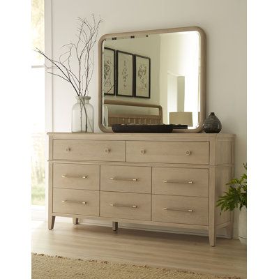 This versatile wall mirror offers dual functionality, designed to be mounted on a dresser or hung on your wall. It's made with a solid rubberwood frame that's simple and unadorned, allowing it to blend seamlessly with various decor styles from traditional to coastal. The beveled glass adds a subtle touch of elegance to your space. This mirror comes with hardware for dresser mounting in a horizontal orientation and keyhole brackets for wall mounting in either orientation (additional hardware requ Coastal Dresser Bedroom, 2 Dressers Side By Side, Double Dresser In Bedroom, Modern Dresser With Mirror, Horizontal Dresser, Townhome Decor, Townhome Decorating, Transitional Dresser, Stylish Mirror