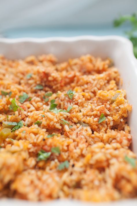 If you love Mexican food but want that restaurant quality food at home, this Traditional Mexican Rice is for you! This recipe is easy to make and bakes in the oven, which locks in the flavor and moisture that makes this recipe so delicious. You'll never go back to eating Mexican rice any other way! Mexican Rice Side Dish, Traditional Mexican Rice, Rice In The Oven, Mexican Rice Recipes, Rice Side, Mexican Dinner Recipes, Rice Side Dishes, Food At Home, Mexican Dinner