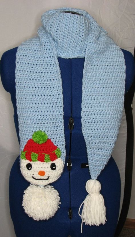 You get the crochet pattern to make this Easy holiday scarf Pom-Pom Snowman. This scarf features a pom-pom and Snowman head at one end and a tassel at the other. All the pieces are made and then layered together to give its detailed look. Finished Size: 6 X 68 You need to Snowman Scarf Pattern, Christmas Crochet Scarf, Half Double Crochet Decrease, Scarf Free Pattern, Snowman Scarf, Snowman Head, Red Heart Super Saver Yarn, Double Crochet Decrease, Crochet Unique