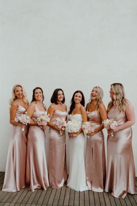 Bride with bridesmaids in pink satin dresses at the Adelphi Hotel Saratoga. Pink Bridesmaid Dresses Matching, Champagne And Light Pink Wedding, Elegant Bridesmaid Dresses Pink, Light Pink Bridal Party, Pink Satin Dresses, Champagne Pink Bridesmaid Dress, Pink And Brown Wedding, Rose Gold Wedding Theme, Baby Pink Bridesmaids Dresses