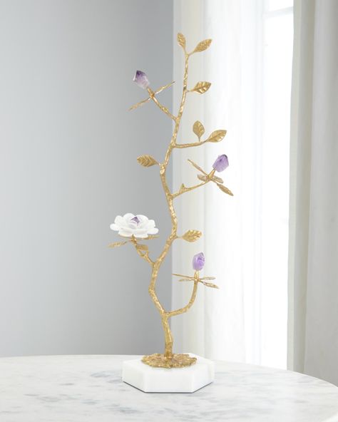 Inspired by the beautiful creations of mother nature, this gorgeous sculpture on a hexagonal base of marble takes the shape of a young tree sapling. Stunning brass branches stretch out from all sides, supporting flower buds of natural amethyst stone. A single flower with selenite petals rests on one of the lower branches, matching the marble base to complete the look. Handcrafted of brass, amethyst, and selenite  Approx. 6"L x 9"W x 26"T Item Weight (Lbs.): 6.0 Wipe clean Impor... Tree Sapling, Oddities Decor, John Richard Collection, New Business Ideas, John Richard, Global Views, Bird On Branch, Dreamy Room, Jar Vase