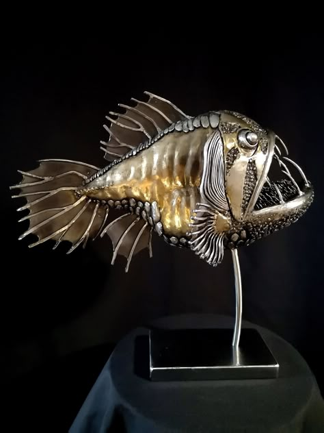 The sculpture was created based on the fairy tale of the poet Alexander Sergeevich Pushkin. In this story, a fisherman caught a goldfish. The fish asks the fisherman to let her go back to the sea, to which she grants his wish... The sculpture is made of metal using electric welding and varnished. Work size 40x17x40 cm. Weight 6.00 kg Fish Goldfish, Steampunk Animals, Electric Welding, Metal Fish, Fish Sculpture, Angler Fish, Gold Fish, Steel Sculpture, Metal Art Sculpture