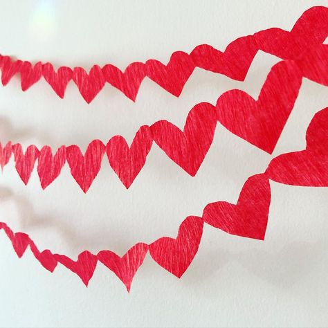 I made crepe paper heart chains from party streamers. So cute and easy! Construction Paper Valentines Decor, Valentine Streamer Ideas, Paper Heart Chain Diy, Heart Curtain Diy Paper, Valentine’s Day Streamers, Diy Streamers, Crepe Streamers, Crepe Paper Crafts, Party Streamers