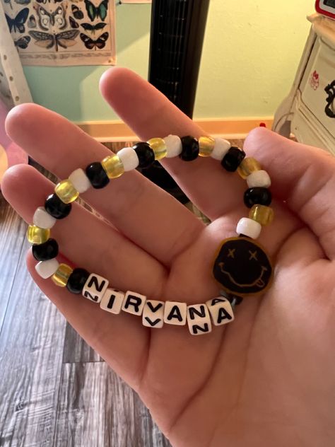 Rock Bracelet Diy, Nirvana Beaded Bracelet, Rock Band Bracelets, Clay Bead Bracelet Ideas Grunge, Emo Clay Bead Bracelets, Clay Bead Bracelet Ideas Emo, Grunge Beaded Bracelets, Eminem Bracelet Ideas, Indie Bracelet Ideas