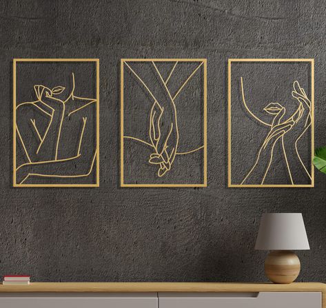 PRICES MAY VARY. RUSTIC CHARM TO ANY ROOM - Vivegate minimalist decor female body single lines wall art sign for home wall decoration comes pre-finished in Gold. Perfect for any home, bedroom, office decor, dorm, classroom, or gym metal wall décor DURABLE MATERIAL - This gold abstract wall art bedroom decor set of 3 decor is made of durable metal iron with rustic tones,not easy to bend or rust, you can keep the wall decor for bedroom for a long period of time and measures 18" long and 12" wide E Abstract Wall Art Bedroom, Hanging Bedroom, Wall Tattoo, Abstract Minimalist, Women Body, Wall Decor Design, Metal Wall Art Decor, Single Line, Female Body