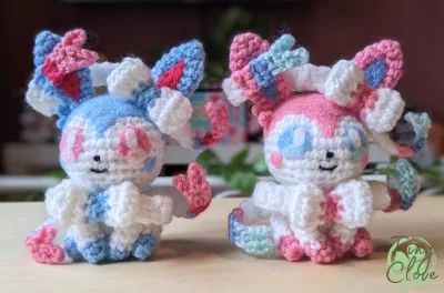 normal and shiny sylveon crochet pattern Crochet Sylveon, Pokemon Sylveon, Stitch Crafts, Pokemon Crochet Pattern, Pokemon Bead, Crochet Pokemon, Pokemon Pattern, Crochet Tutorial Pattern, Plushie Patterns