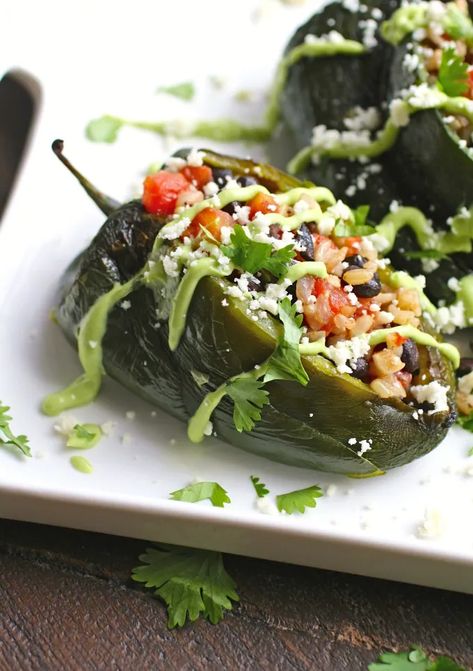 Black Bean and Rice Stuffed Poblano Peppers with Avocado Cream Black Bean And Rice, Bean And Rice, Fall Meal, Latin Recipes, Black Beans And Rice, Poblano Peppers, Avocado Cream, Beans And Rice, Stuffed Poblano Peppers