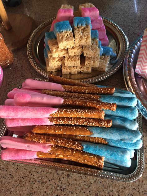 Pretzel Rods and Rice Krispy Treats dipped in pink and blue candy melts and sprinkled with sanding sugar Pink Pretzel Rods, Dipped Sweets, Pretzel Rods Recipe, Pink And Blue Candy, Sanding Sugar, Blue Frosting, Krispy Treats, Pretzel Rods, Rice Krispy