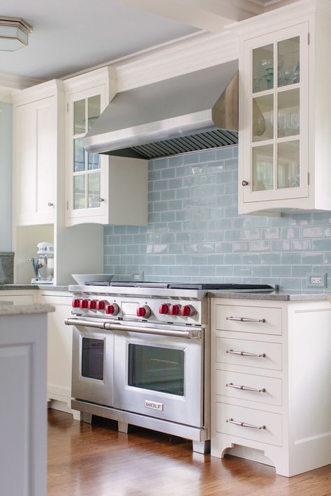 Icy blue subway tile is a fetching counterpoint to white cabinetry (and gives hardworking white subway tile a break) in this traditional kitchen. Blue Subway Tile, Bold Kitchen, White Kitchen Backsplash, Classic White Kitchen, Blue Backsplash, Kitchen Cabinets Decor, Kitchen Cabinets Makeover, White Cabinetry, Grey Kitchen Cabinets