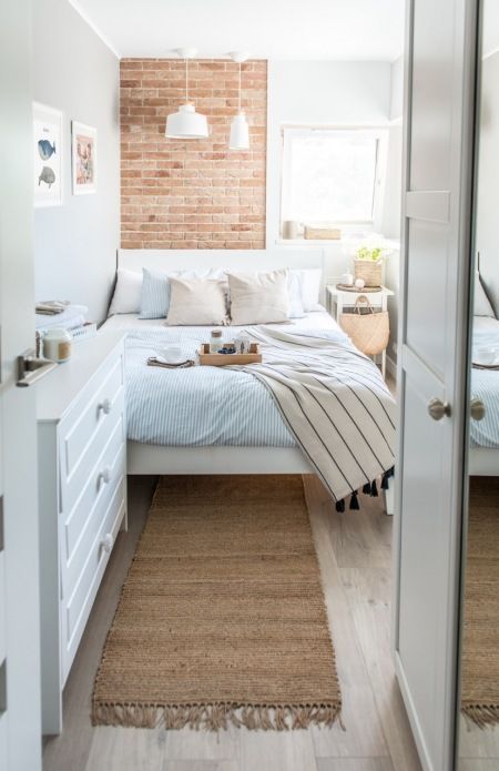 a narrow light filled bedroom with a dresser, a bed with neutral bedding, pendant lamps and a nightstand with some decor Bedroom Inspirations For Small Rooms, Small Apartment Bedrooms, Small Bedroom Designs, Bilik Tidur, Small Bedroom Decor, Trendy Bedroom, Tiny Bedroom, Simple Bedroom, घर की सजावट