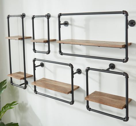 Perfect as a display piece, this design is crafted from pine wood and enhanced with an industrial support pipe. This shelf adds rustic warmth and style to any wall and supplements useful storage space. Use the shelf to provide a secure spot to display your treasured decor, including photos, small sculptures, and artwork. Furniture of America Sand Black; Light Pure Copper 27.5-in L x 7.25-in D Metal Floating Shelf (1 Shelves) | IDF-AC543A Industrial Pipe Furniture, Metal Floating Shelves, Decorative Shelves, Metal Wall Shelves, Unique Shelves, Pipe Decor, Salon Suites, Pipe Furniture, Pipe Shelves