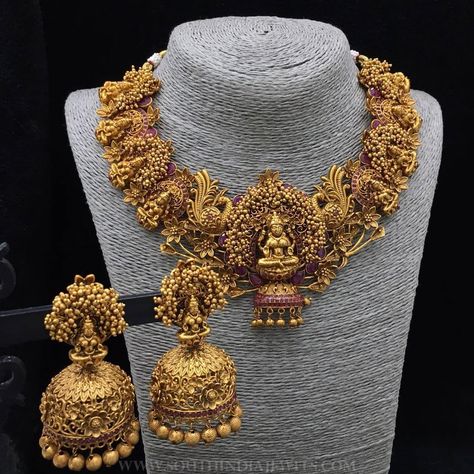 Bold bridal temple necklace set and matching jhumka. For inquiries please contact the seller below. Seller Name : Emblish Instagram : https://www.instagram.com/emblishcoimbatore/ Facebook : https://www.facebook.com/emblishcoimbatore Contact : +91-9994644041 Related Posts160 Grams Gold Neclace With Krishna PendantStone Mango Necklace Set 2017 ModelTraditional Temple Necklace SetAntique Lakshmi Necklace Set22K Gold Temple Lakshmi Necklace from ThangamayilLight Weight Pachi … Non Traditional Wedding Rings, Traditional Wedding Rings, Temple Jewelry Necklace, Gold Temple Jewellery, Jewelry Set Design, Gold Necklace Indian Bridal Jewelry, Bridal Necklace Set, Non Traditional Wedding, Temple Jewelry