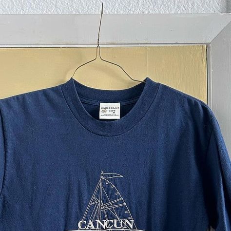 Reselling Denver on Instagram: "Vintage embroidered tshirt. Navy blue shirt and cream Cancun sailboat embroidery. Labeled a medium but fits baggy. Would be good for distressing. Granola girl, coastal, outdoorsy. $16+ ship #resellingdenver #granolagirl" Granola Graphic Tees, Granola Tshirts, Sailboat Embroidery, Fits Baggy, Navy Blue Shirt, Navy Blue Shirts, Granola Girl, Embroidered Tshirt, Blue Shirt