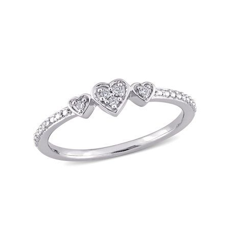 Commence the new phase of life with this delicate Miabella Triple Heart Promise Ring. Crafted in sparkling sterling silver, this petite ring showcases five round-cut, pave-set diamonds (G-H, I2-I3) placed in three heart motifs. Enhanced with a high polished finish, this dainty ring will always be a symbol of your unconditional love and commitment towards her. An accessory that she will proudly flaunt at every occasion. Size: 6.5.  Color: White.  Gender: female.  Age Group: adult. Sterling Silver Heart Ring, Cute Promise Rings, Double Heart Ring, Heart Promise Rings, Triple Heart, Petite Ring, Prom Accessories, Beautiful Diamond Rings, Jewelry Accessories Ideas