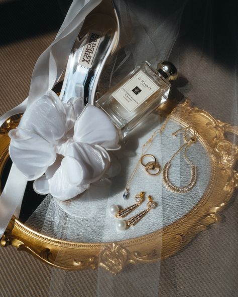 Jo Malone London Badgley Mischka Amélie George Bridal | Modern Wedding Accessories photo by weddings by md, wedding band by James and Sons | white satin bridal shoes, bow heels, pearl drop bridal earrings, vintage gold ring, wedding perfume, wedding fragrance, nectarine blossom and honey, aquamarine necklace, something old something new something borrowed something blue, editorial wedding details Jo Malone Wedding Perfume, Wedding Heirloom Ideas, Wedding Shoes And Rings Photo Ideas, Ring Box Wedding Photo, Bridal Product Photography, Ring Photos Wedding, Old Money Wedding Details, Vintage Wedding Details, Details Photo Wedding