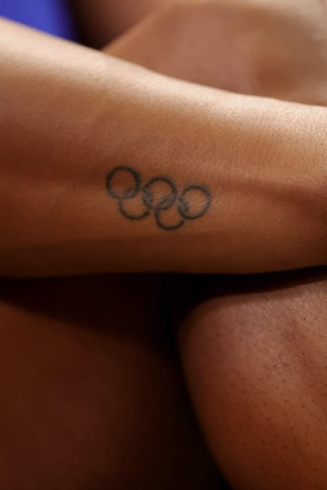 Olympic Rings Tattoo Small, Track And Field Tattoos Ideas, Olympic Tattoo Ideas, Olympic Motivation, Tattoos For Athletes, Olympic Games Aesthetic, Olympic Rings Tattoo, Athlete Tattoos, Track Tattoo