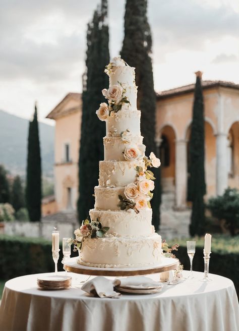 Elegant Wedding Cake Perfection: A Fine Art Dream in Coastal Italy  Prepare to be mesmerized by this exquisite tall wedding cake, captured in the soft light of a classic Italian villa. Its delicate tiers, adorned with intricate designs, evoke a timeless elegance. 👰🤵🏼‍♂️💍 #WeddingCake #FineArt #ItalianVilla #CoastalCharm #WeddingInspiration Classic Wedding Cakes Elegant, Vintage Wedding Cakes Elegant, French Wedding Cake, Tall Wedding Cake, French Wedding Cakes, Coastal Italy, Tall Wedding Cakes, Italian Wedding Cakes, Garden Wedding Cake