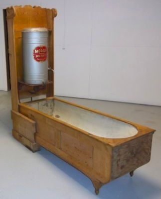 Mosely Folding Bath Tubs were featured at the Chicago World's Fair in 1893 and were advertised as "no bathroom required"! This one (not in top shape) is for $2,500.   If you ever see one for $1,000 or less...GRAB IT!!!!!  The will only go up in price!!!!!  This one isn't as ornate and rich of wood as others.  When folded up it looks like a piece of furniture - adorned with ornate door knobs to resemble a closet! Victorian Bathrooms, Antique Bathtub, Ornate Door, Portable Bathtub, Campaign Furniture, Victorian Bathroom, Water Storage Tanks, Bath Tubs, Vintage Bath