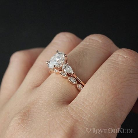 Every piece of jewellery tells a story, like a biography of your life. What would this 3 stone, colorless, forever one moissanite engagement ring say about your story? The band is half round and is 1.5mm wide. The raised shoulders allows this ring to stack easily with all our wedding bands. (Shop link in bio.) #foreveronemoissanite #lovebyohkuol    #Regram via @lovebyohkuol Stone Ring Design, Engagement Ring Pear, Wedding Band Vintage, Oval Moissanite Engagement Ring, Pear Cut Engagement Rings, Pear Shaped Ring, Moissanite Engagement Ring Oval, 3 Stone Engagement Rings, 3 Stone Rings