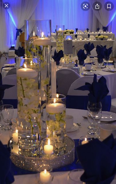 Blue Royal Wedding Decoration, Royal Blue Floating Candles, Royal Themed Wedding Decor, Blue And Gold Flower Centerpieces, Royal Blue Centerpieces Party, Royal Blue And Silver Wedding Decor, Quince Centerpieces Blue, Royal Blue Quince Table Decor, Navy Blue Quince Centerpieces