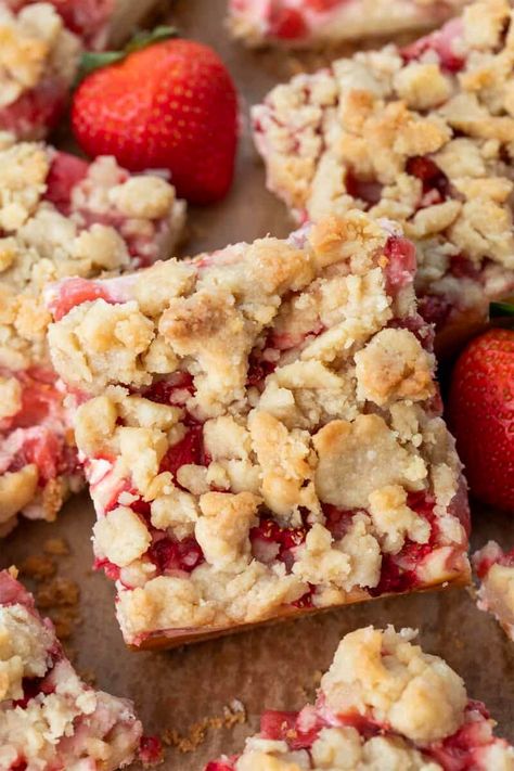 Strawberry Cheesecake Bars are dessert bars with a cheesecake filling layered fresh strawberries over a graham cracker crust and topped with a crumble topping. All three layers give you a sweet treat in every bite, perfect for any occasion! Strawberry Crumb Bars, Strawberry Cheesecake Bars, Crumb Bars, Strawberry Dessert Recipes, Buttery Shortbread, Cheesecake Filling, Cracker Crust, Bar Cookies, Easy Strawberry